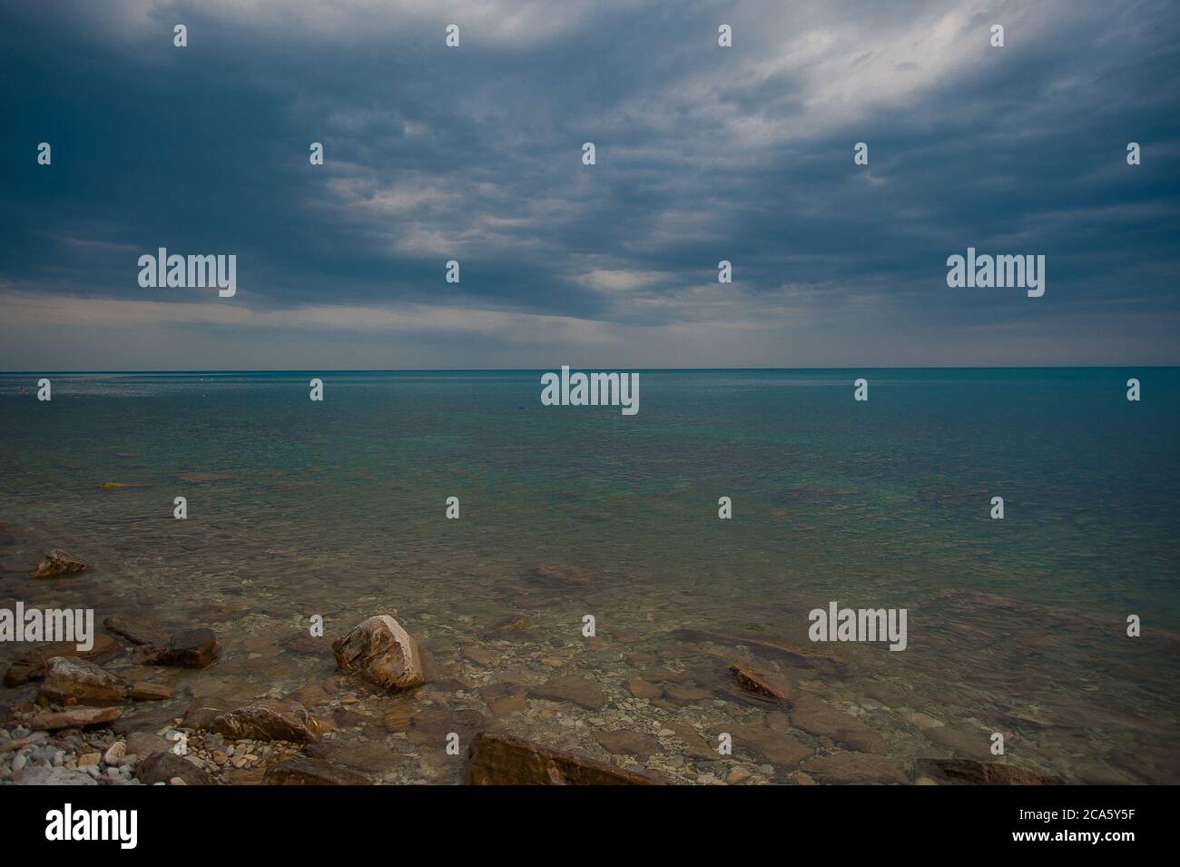 Large rocky beach family hi-res stock photography and images - Alamy