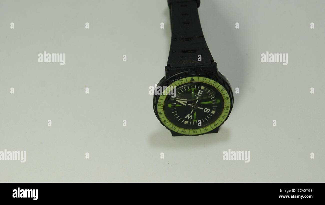 Wristwatch. watch with compass, black color, compass on black dial, on white background, copy space, Brazil, South America Stock Photo
