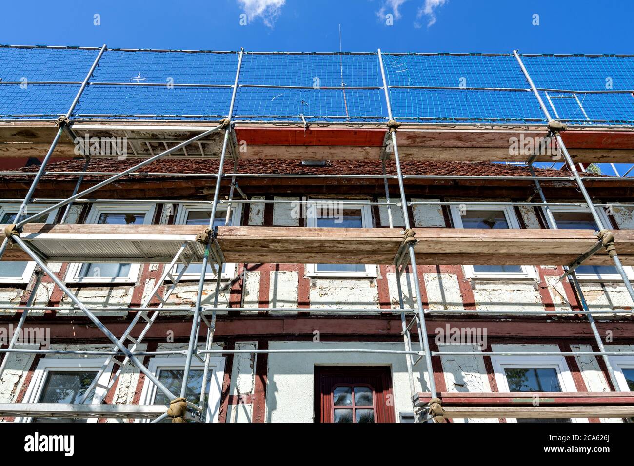 scaffolding at half-timbered house currently under renovation Stock Photo