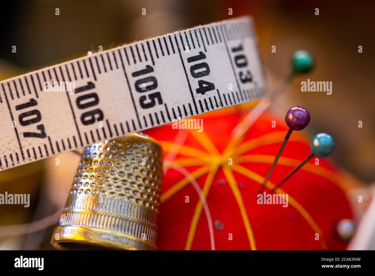 Detail of different objects that we can find in a sewing box threads, needles, pins, thimble