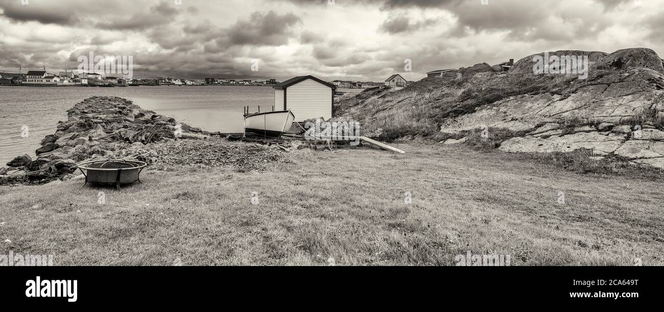 View of fishing stage on sea coastline, Tilting, Fogo Island, Newfoundland Stock Photo