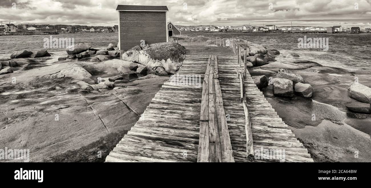 View of fishing stage on sea coastline, Tilting, Fogo Island, Newfoundland Stock Photo