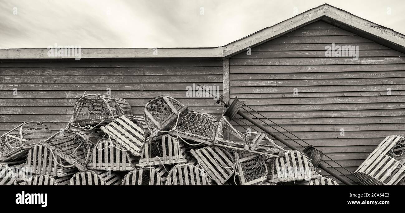 View of building and fish baskets, Trout River, Fishing Village, Gros Morne National Park, Newfoundland Stock Photo