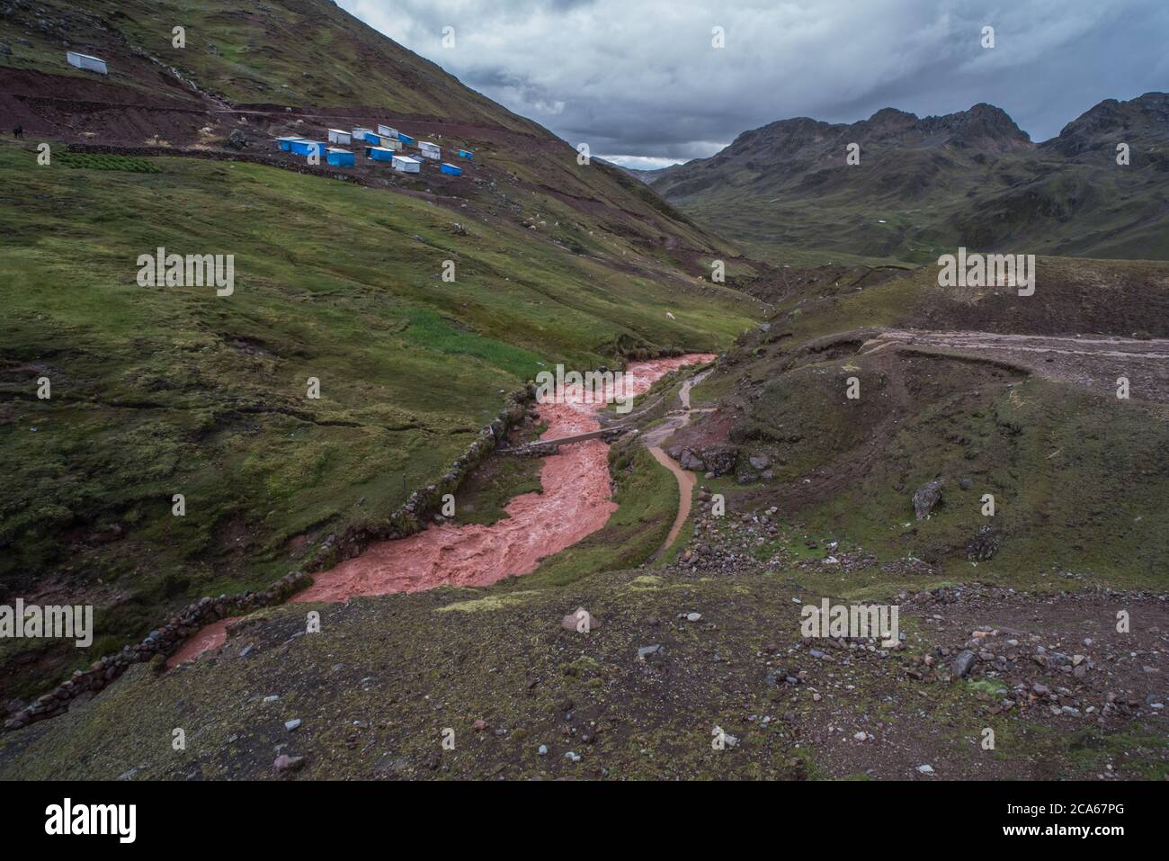 Hasty construction of the road to rainbow mountain in Peru leads to formerly clean rivers choked with sediment and runoff from erosion. Stock Photo