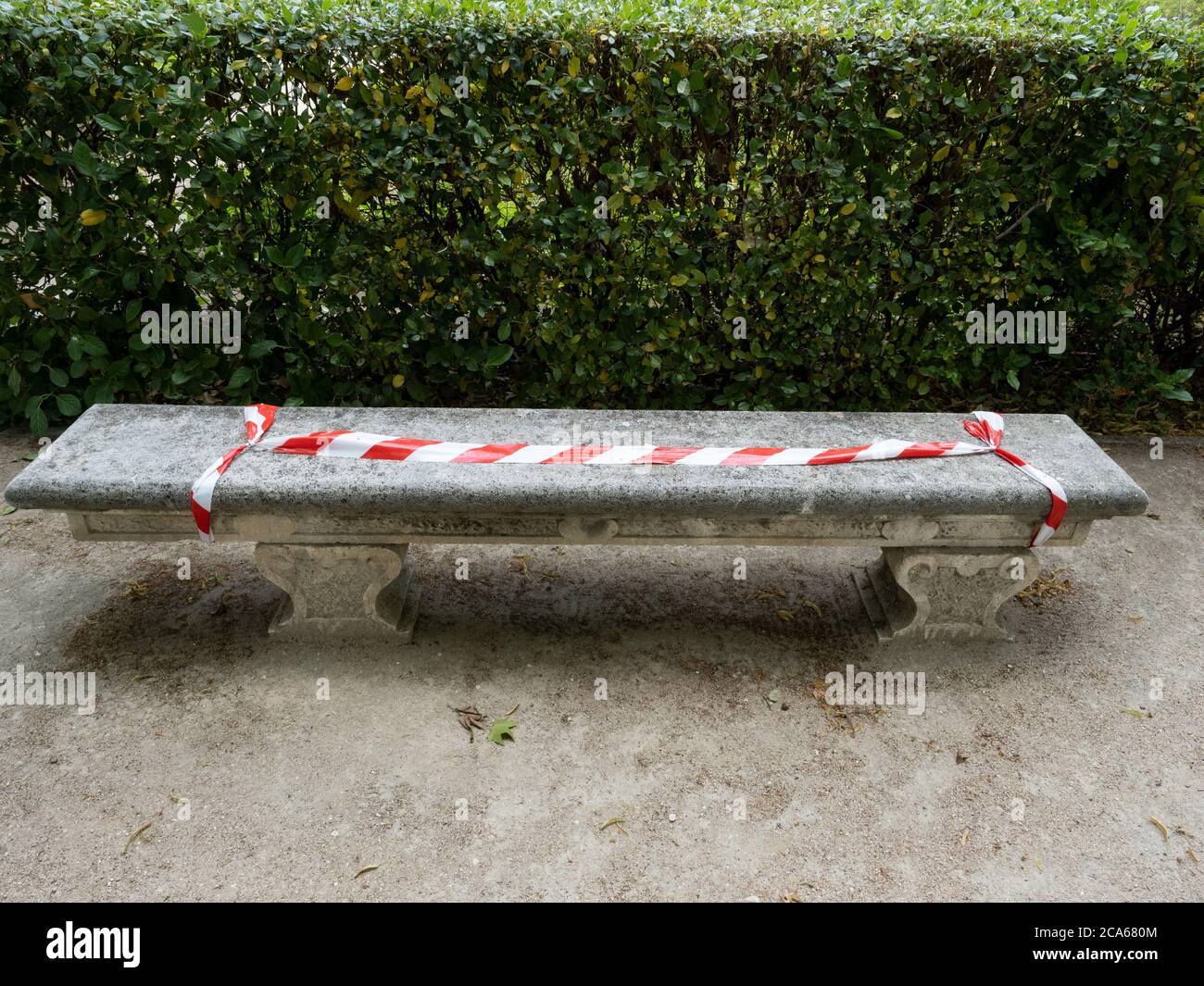 A sealed bench in order to avoid being used at the Royal Botanical Garden of Madrid. Stock Photo