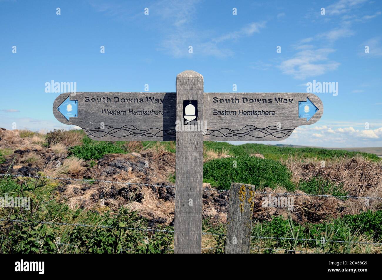 A fingerpost on the South Downs Way in East Sussex marking the Greenwich Meridian. It is the line through which longitude is measured. Stock Photo