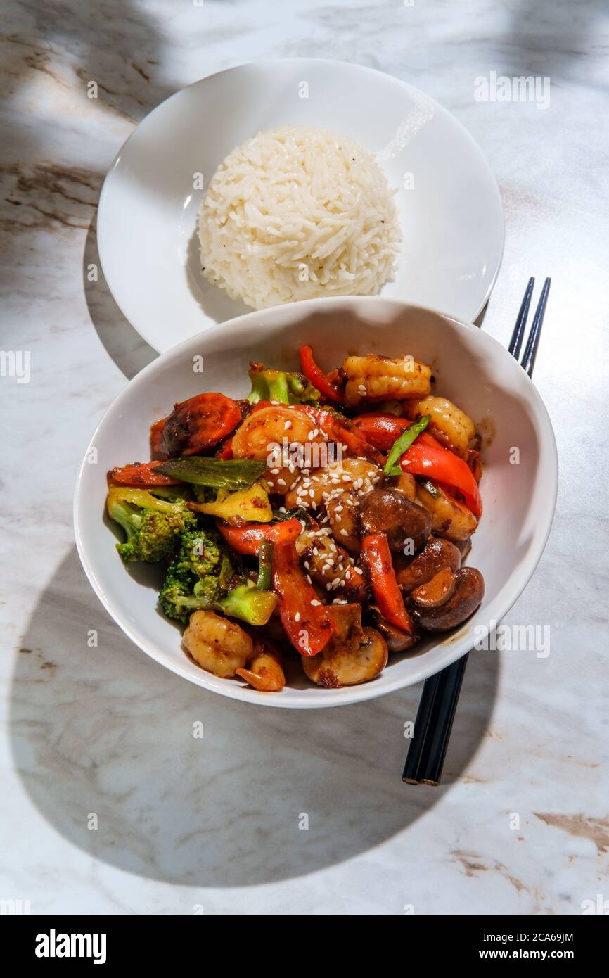 Chinese shrimp with mixed sauteed vegetables in a brown garlic sauce
