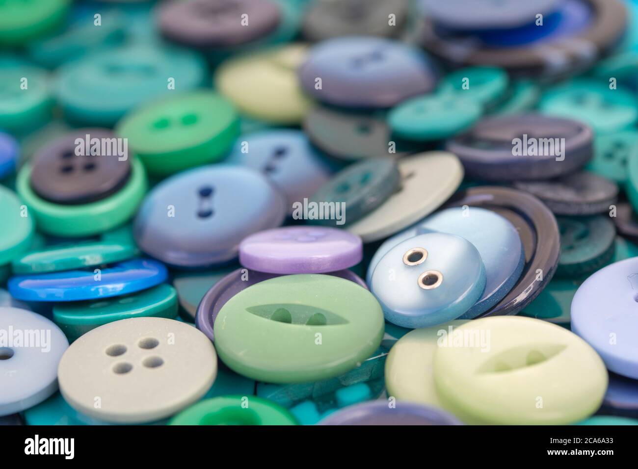 Closeup image of green, lavender and blue buttons Stock Photo