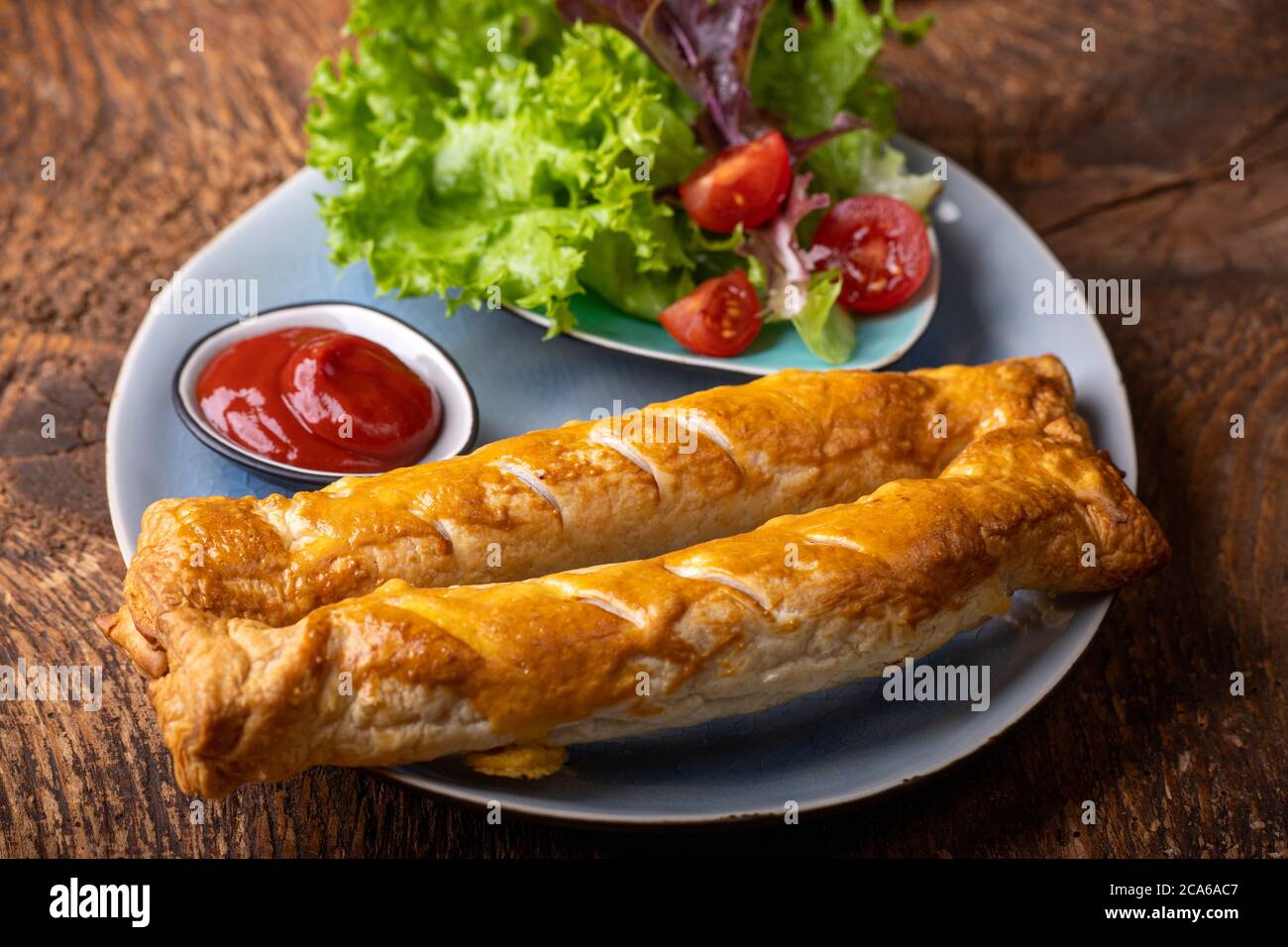 frankfurters in puff pastry on a plate Stock Photo Alamy