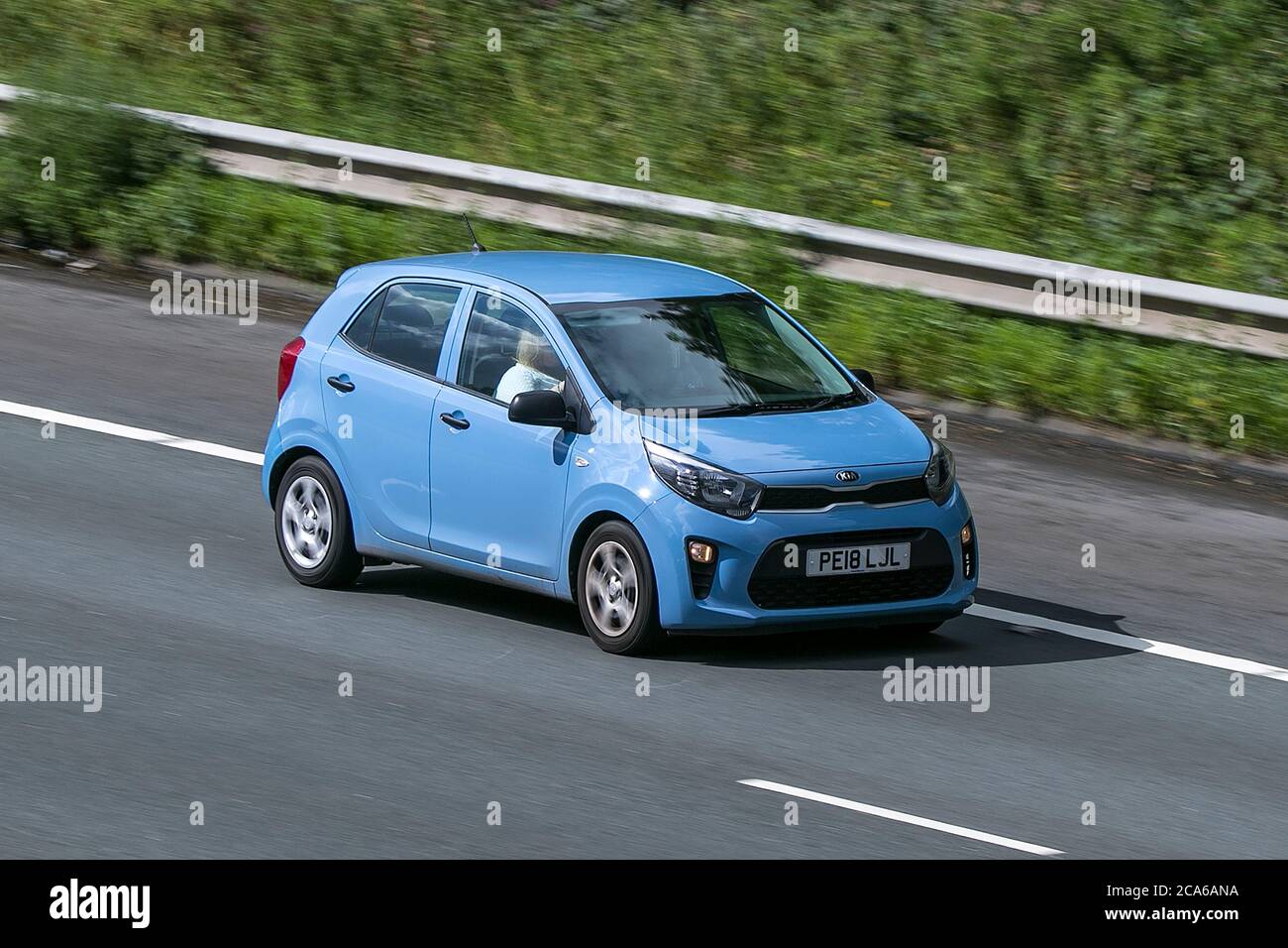 A 2018 KIA Picanto 1 Blue Car Hatchback Petrol driving on the M6 motorway near Preston in Lancashire, UK Stock Photo