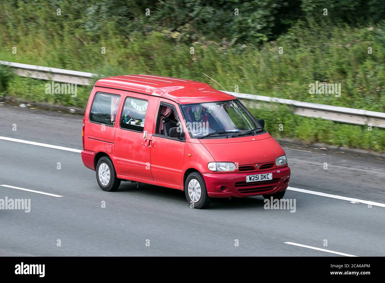 A 2000 Nissan Vanette Cargo Red LCV Window Van Diesel Driving On The M6 