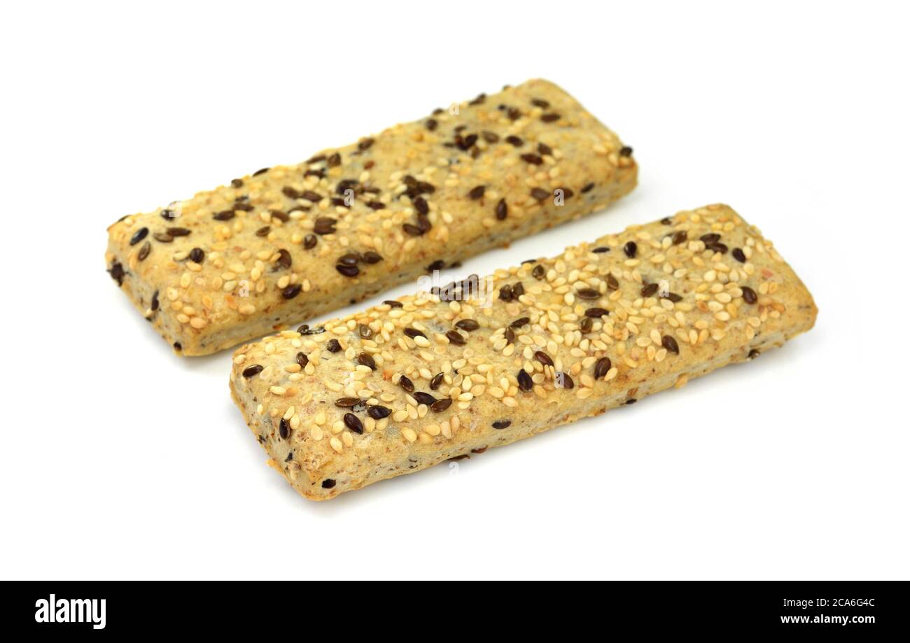 Breadsticks or grissini with sesame and linseed isolated on white