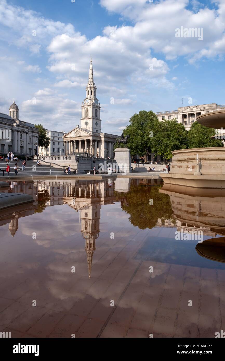 Faded red dye in the fountains, following protest by Animal Rebellion. Trafalgar Square, London, UK Stock Photo