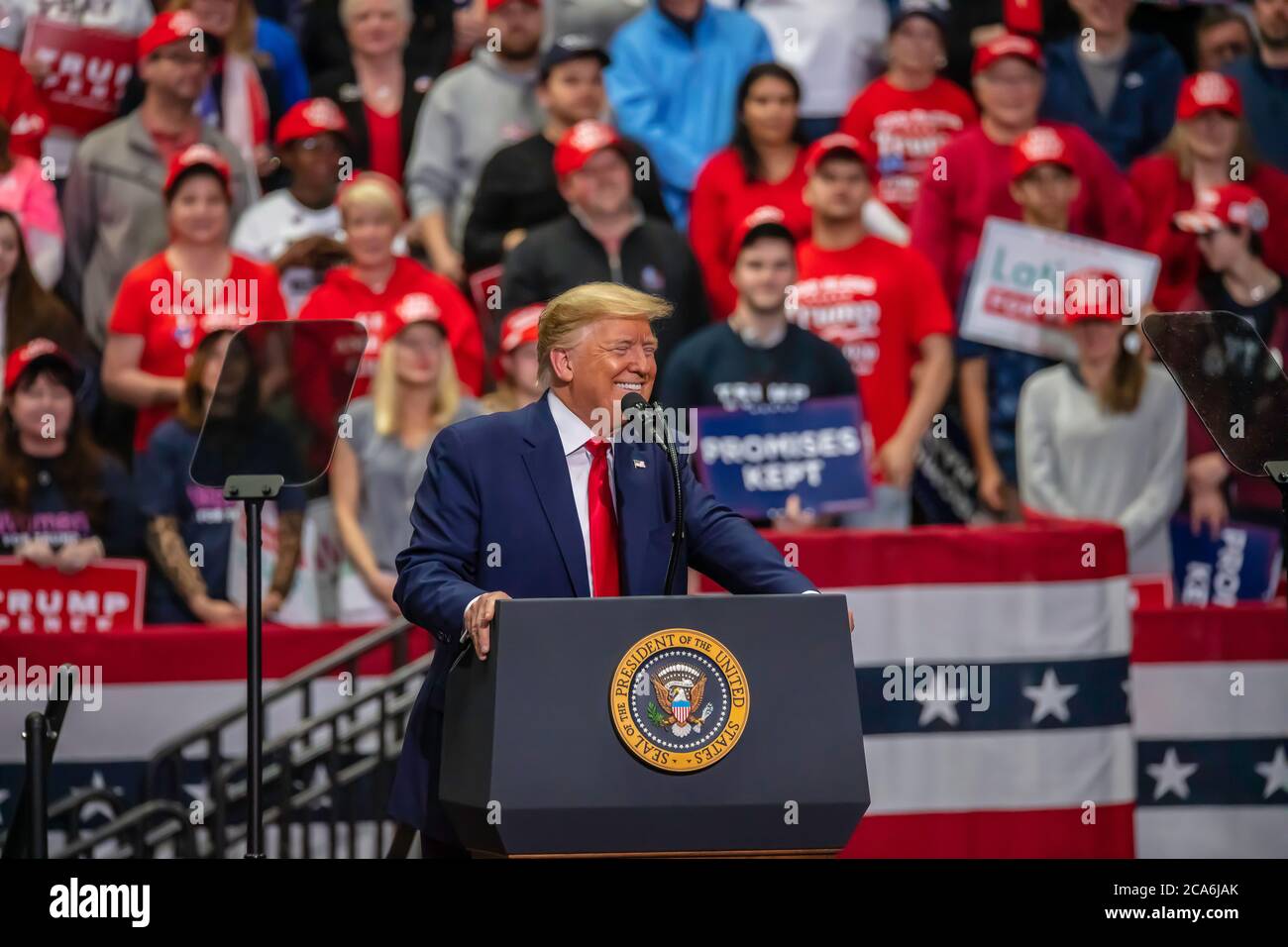 President Trump is all smiles toward his supporters at the rally in the Bojangle's Coliseum Stock Photo