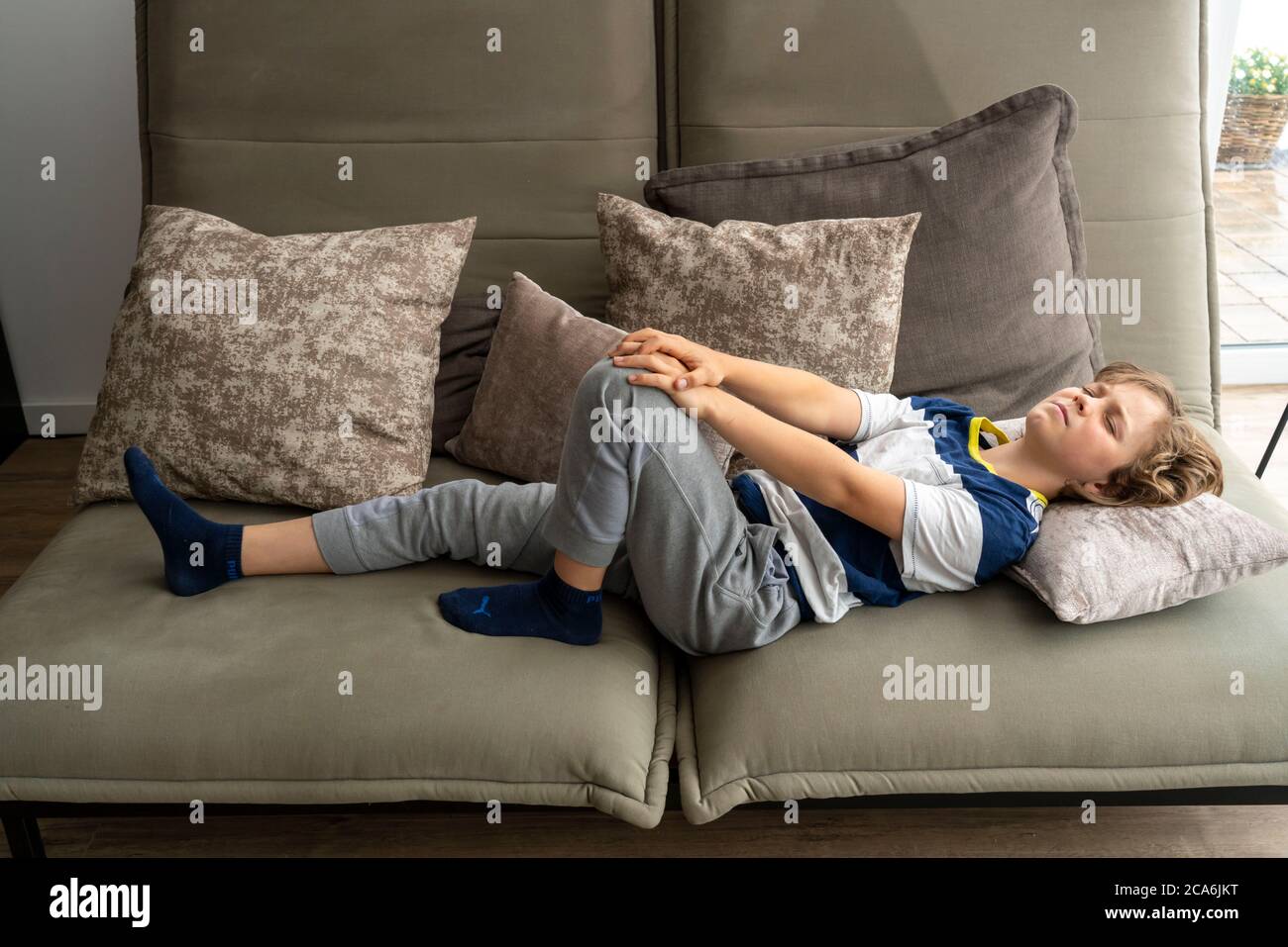 Growth pain in children, boy, 10 years old, has pain in the leg