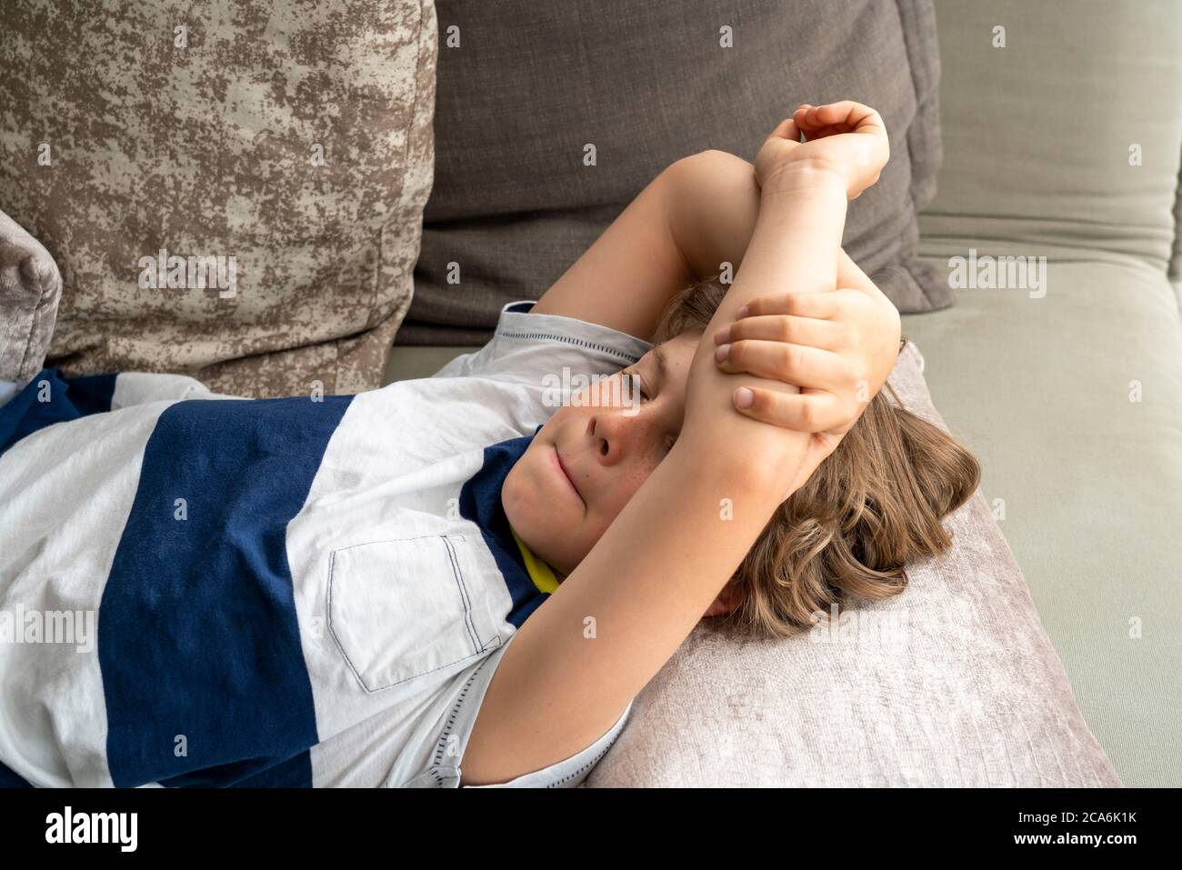 Growth pain in children, boy, 10 years old, has pain in the leg, symbolic image, Stock Photo