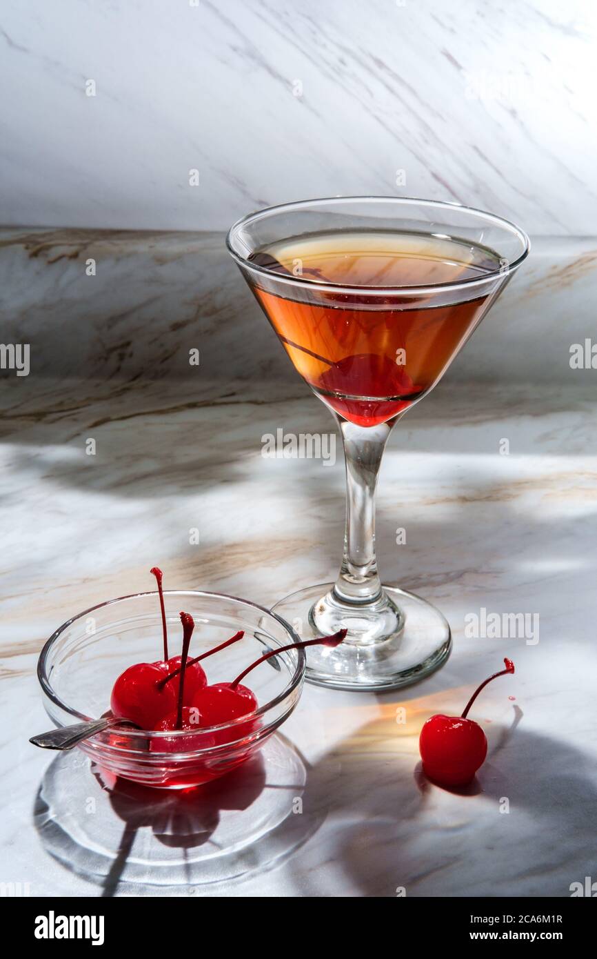 Old fashioned whiskey cocktail with maraschino cherry garnish Stock