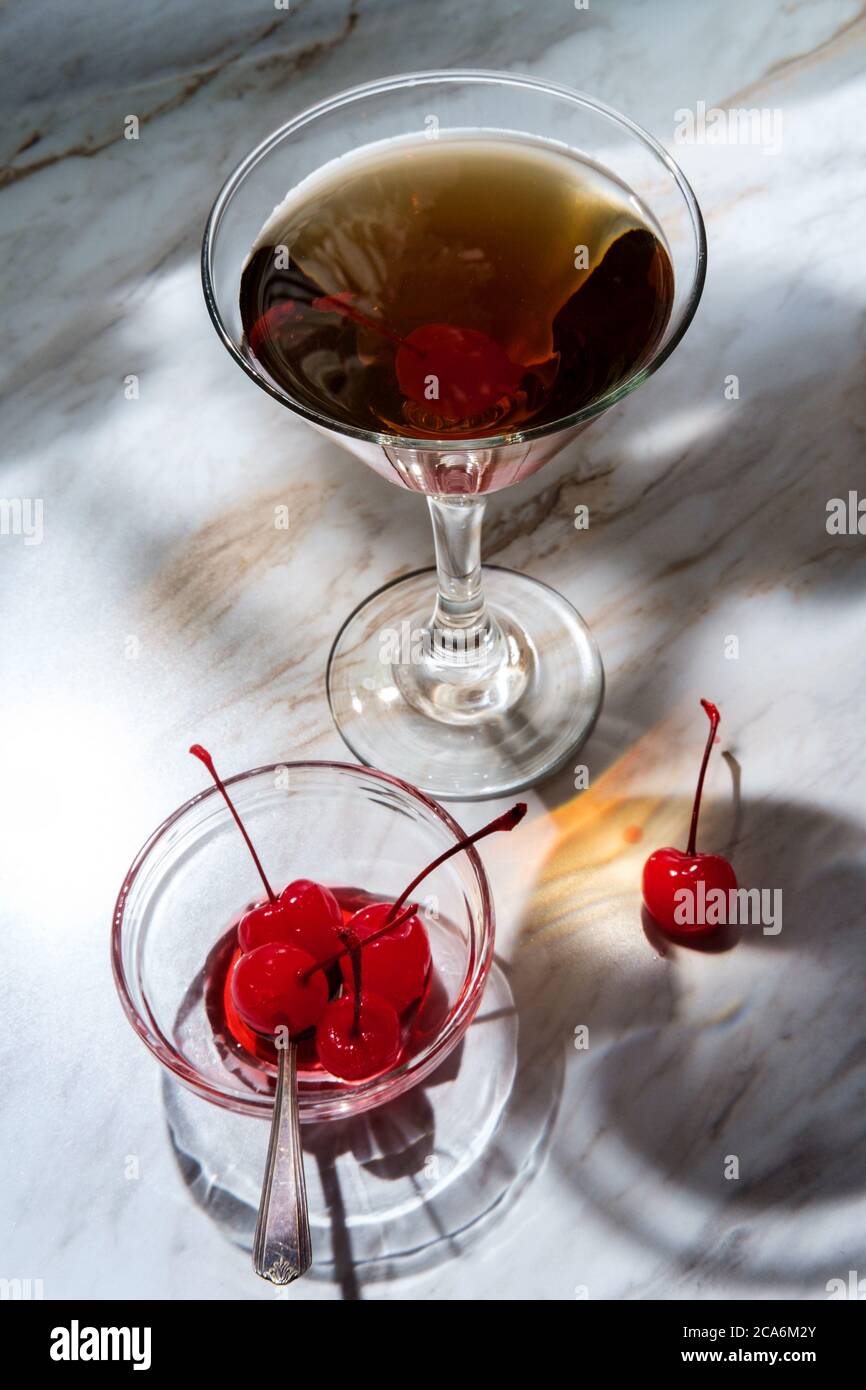 Old fashioned whiskey cocktail with maraschino cherry garnish Stock