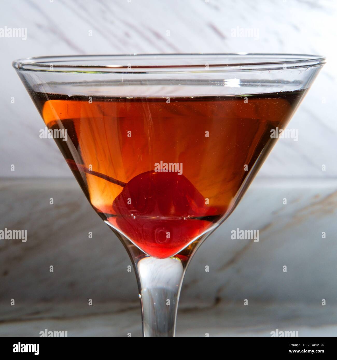 Old fashioned whiskey cocktail with maraschino cherry garnish Stock