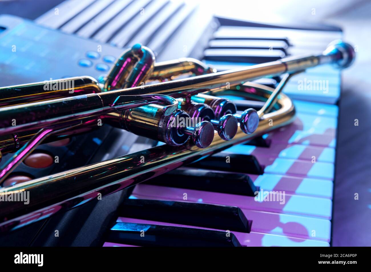 Old and worn Jazz trumpet and piano keyboard musical show and