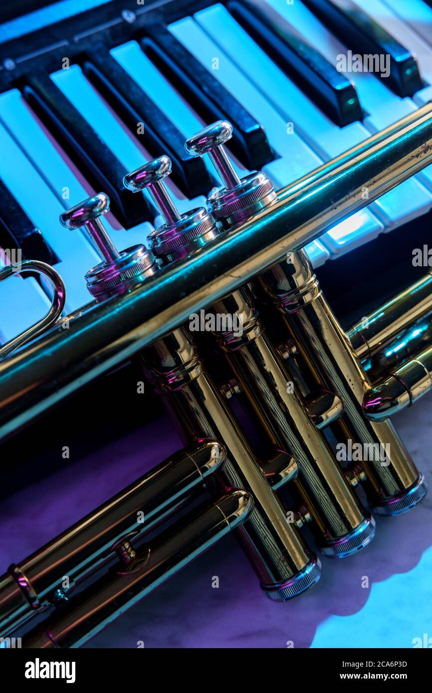 Old and worn Jazz trumpet and piano keyboard musical show and