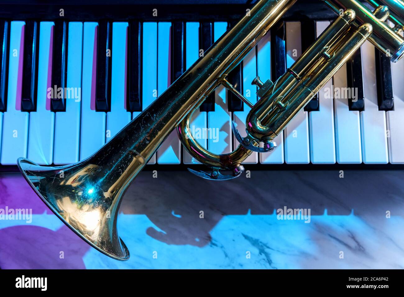 Old and worn Jazz trumpet and piano keyboard musical show and