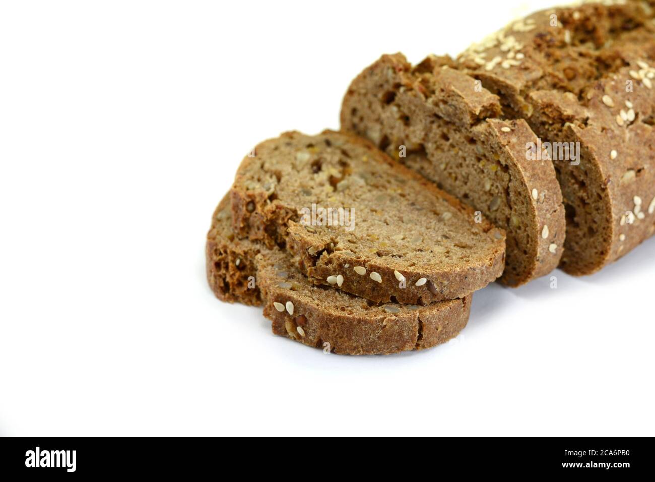 slices of black bread with pumpkin seed and sesame isolated on white ...