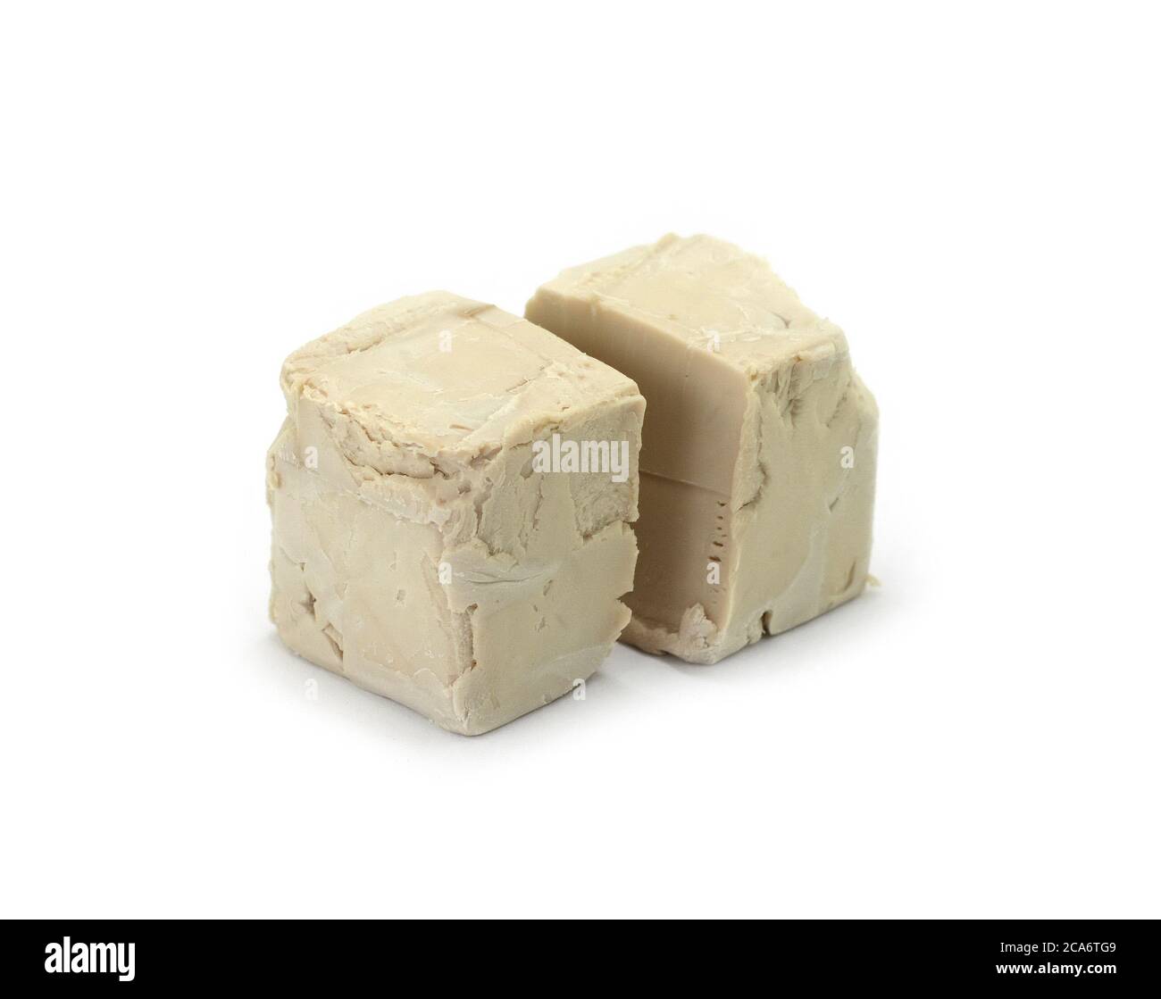 Baker's yeast isolated on white background. A block of compressed fresh