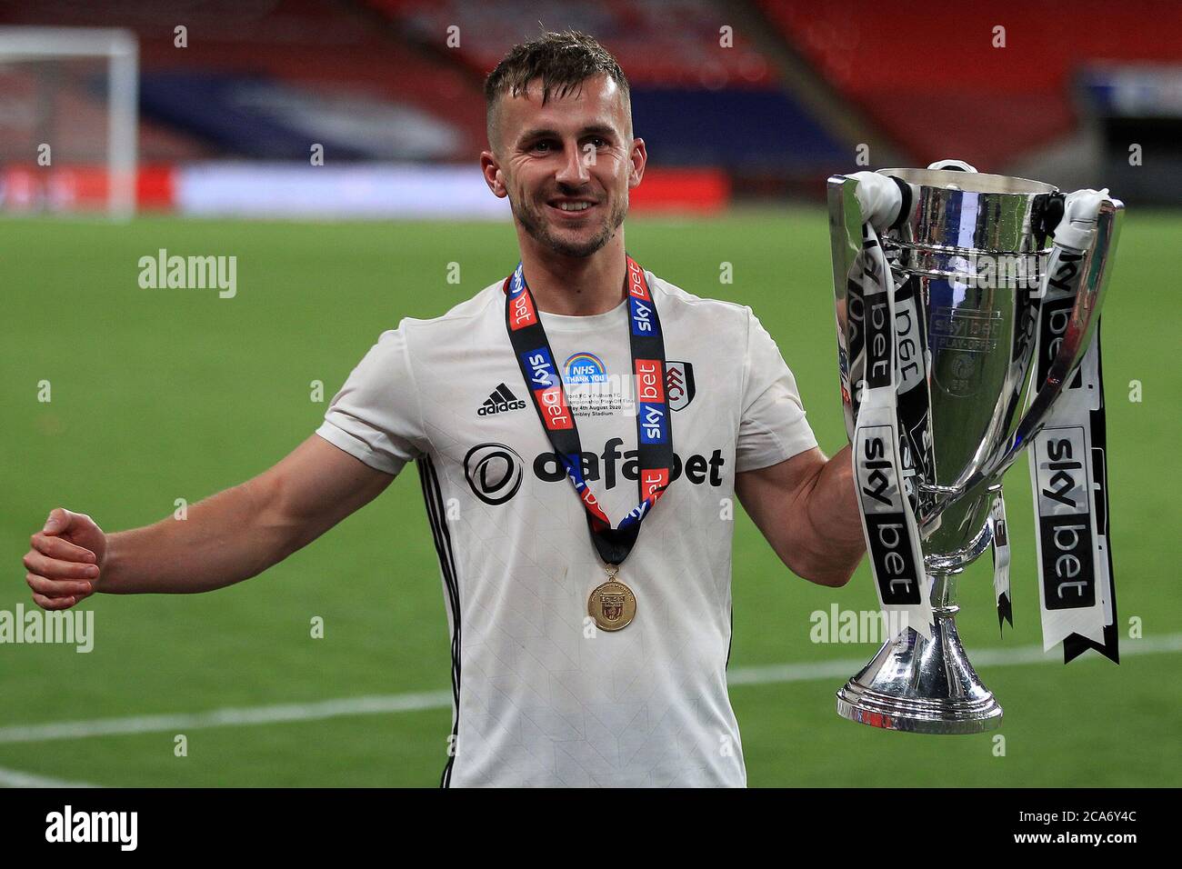 London, UK. 04th Aug, 2020. Goal scorer Joe Bryan of Fulham celebrates with the play off trophy after the match. EFL Skybet Championship play off Final, Brentford v Fulham at Wembley Stadium in London on Tuesday 4th August 2020. this image may only be used for Editorial purposes. Editorial use only, license required for commercial use. No use in betting, games or a single club/league/player publications. pic by Steffan Bowen/Andrew Orchard sports photography/Alamy Live news Credit: Andrew Orchard sports photography/Alamy Live News Stock Photo