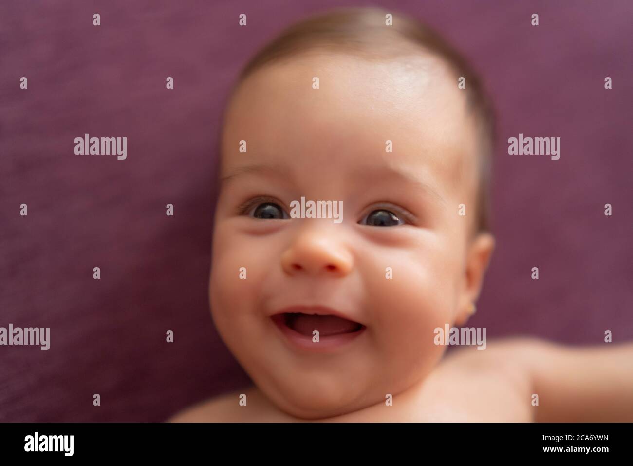 beautiful baby smiling at the camera Stock Photo