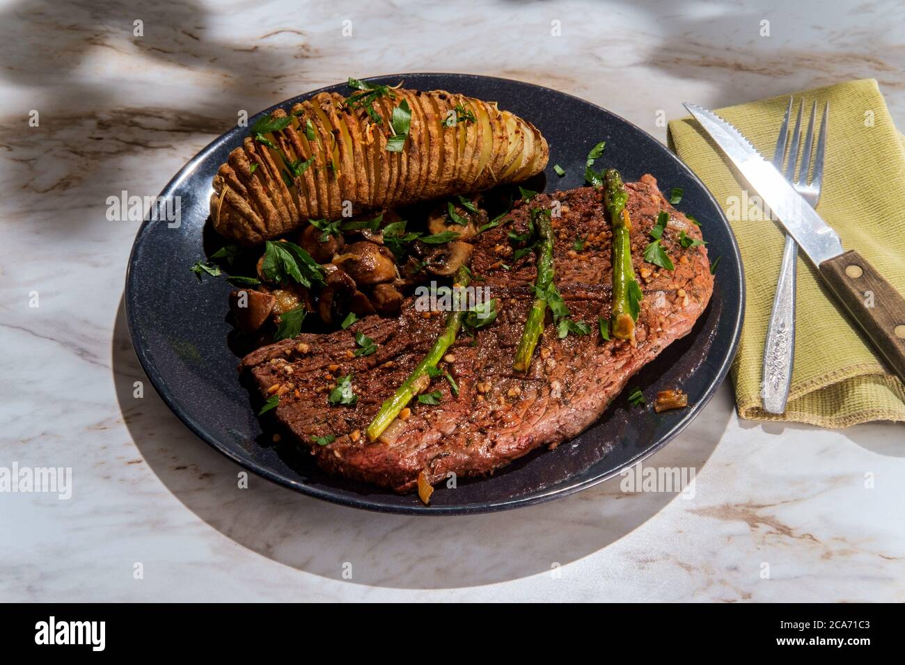 Sirloin tip steak with potato a la hasselbacken mushrooms and asparagus