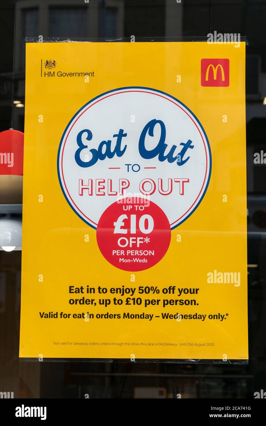 Macdonalds fast food restaurant street sign promoting the Eat Out to Help Out scheme offering diners a discount off meals to help boost restaurants and pubs post-lockdown. Stock Photo