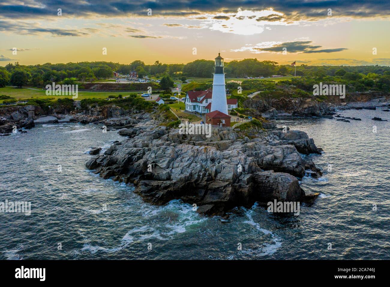 Aerial view of Portland Head Lighthouse at sunset in Fort Williams Park, Cape Elizabeth, Maine, located at the entrance into Portland Harbor. Stock Photo