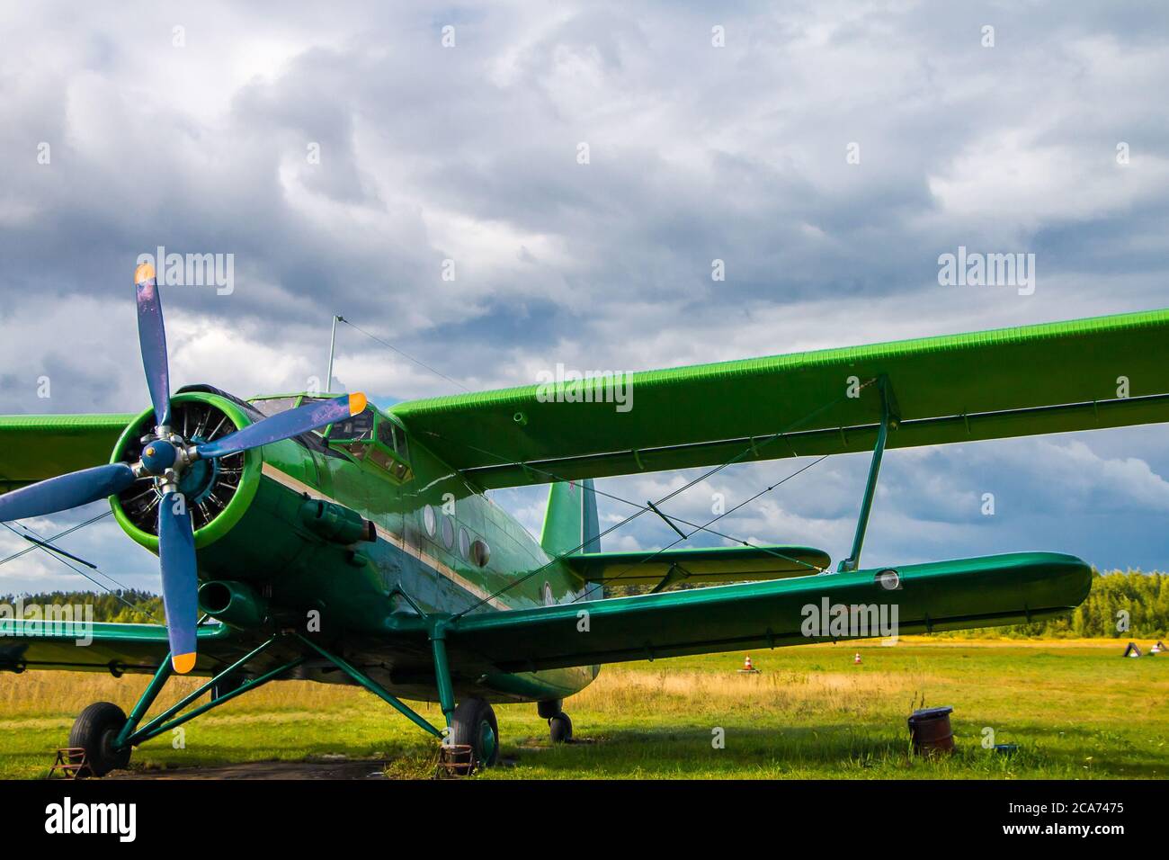 Russia, Tver - 08.15.2015: Vintage aircraft preparing for take-off on the background of a stormy sky Stock Photo