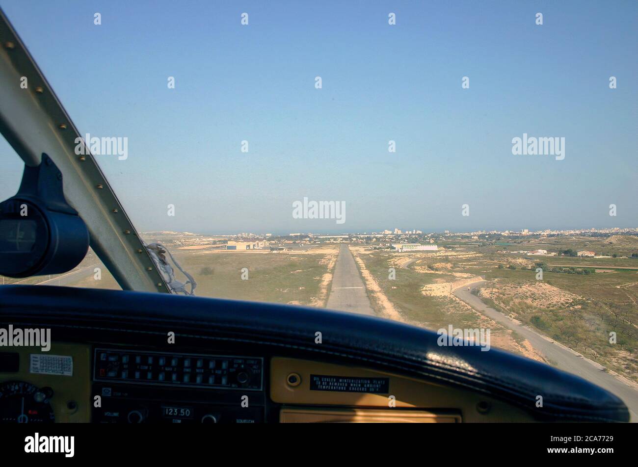 small plane landing on a small airfield Stock Photo