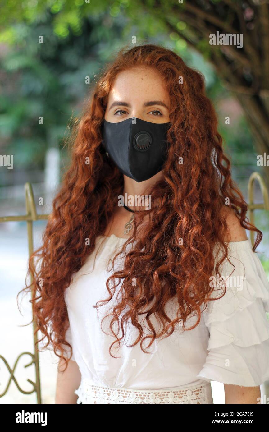Redhead girl with covid mask Stock Photo Alamy