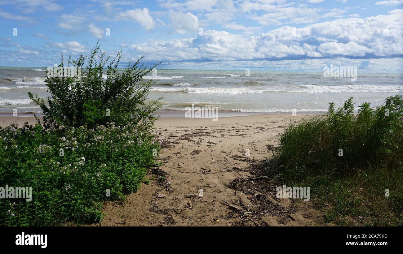 Wind advisory brings rough surf to Lake Michigan's Illinois shore on a summer day. Stock Photo