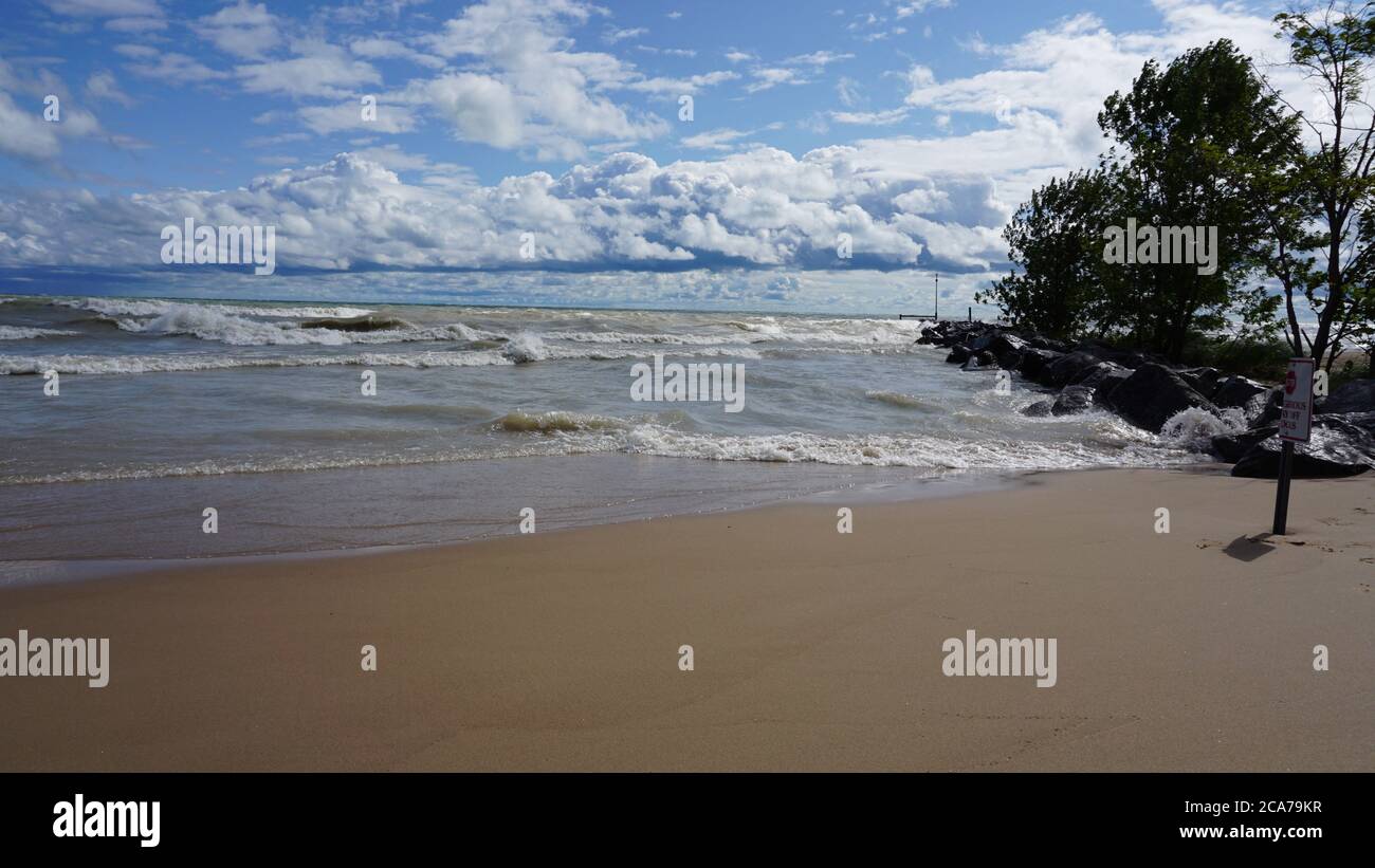Wind advisory brings rough surf to Lake Michigan's Illinois shore on a summer day. Stock Photo