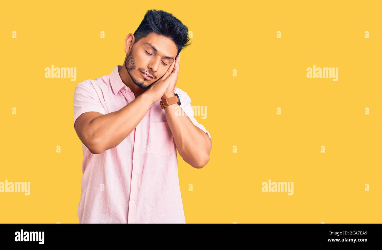 Handsome latin american young man wearing casual summer shirt sleeping ...