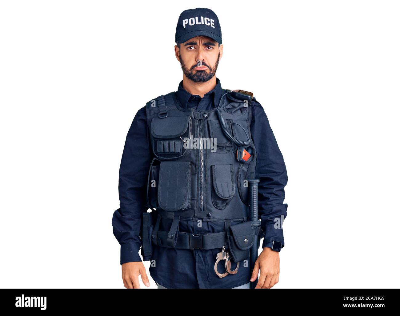 Young hispanic man wearing police uniform depressed and worry for distress, crying angry and afraid. sad expression. Stock Photo