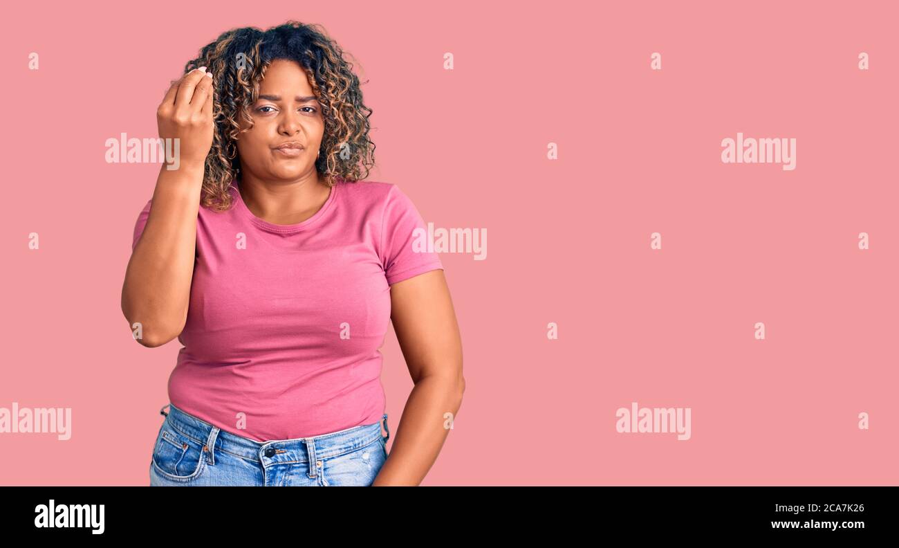 Young african american plus size woman wearing casual clothes doing italian  gesture with hand and fingers confident expression Stock Photo - Alamy