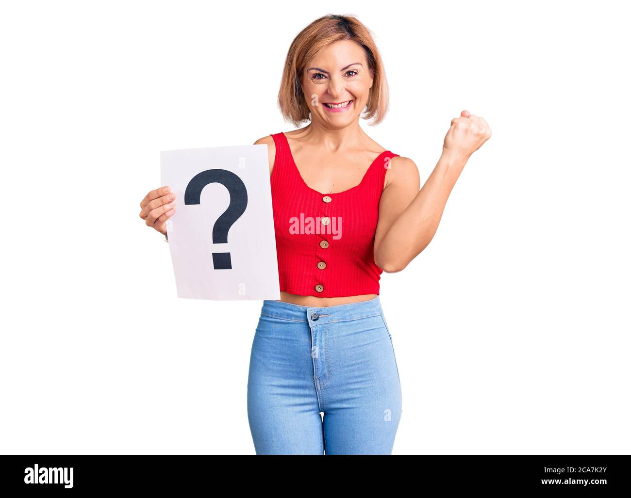 Young blonde woman holding question mark screaming proud, celebrating ...