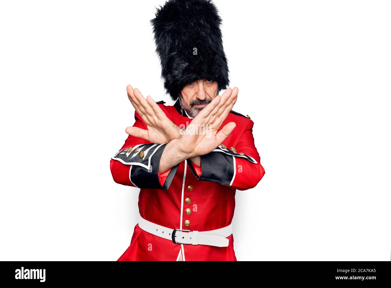 Middle age handsome wales guard man wearing traditional uniform over ...