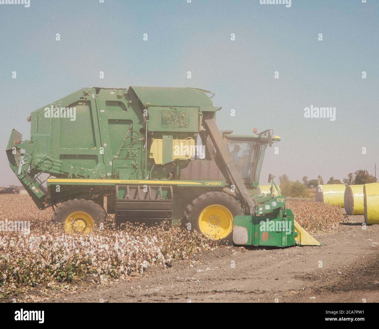 A cotton harvester at work on a cotton farm in the Central Valley, California Stock Photo Alamy