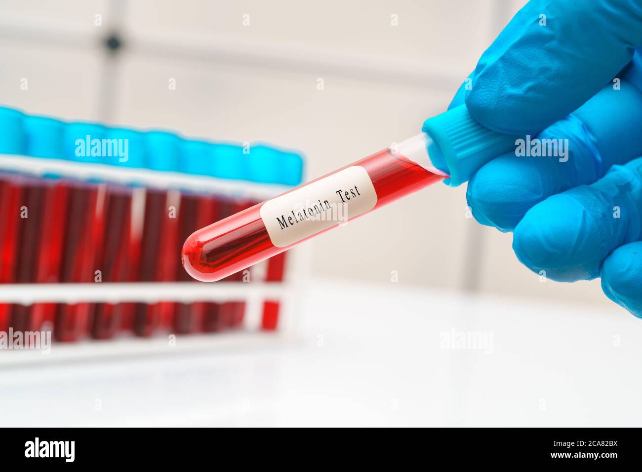 Blood sample   test tube in doctor hand for  Melatonin hormone test Stock Photo