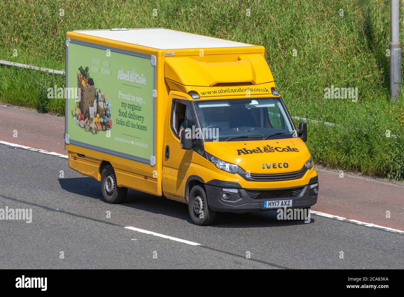 Yellow Abel and Cole food delivery trucks, a depot, service