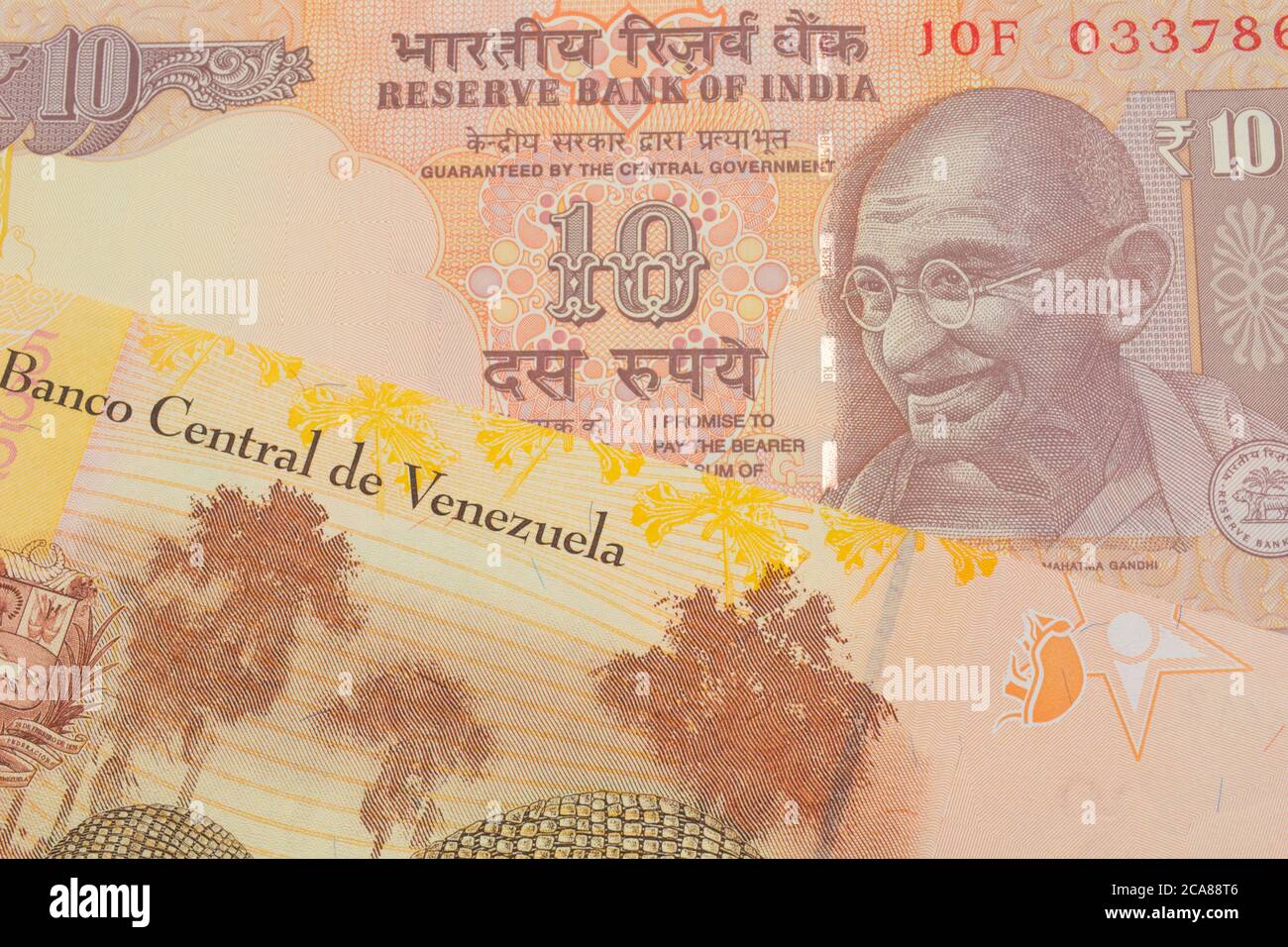 A Macro Image Of A Orange Ten Rupee Bill From India Paired Up With A Colorful Yellow Five Bolivar Bank Note From Venezuela Shot Close Up In Macro Stock Photo Alamy