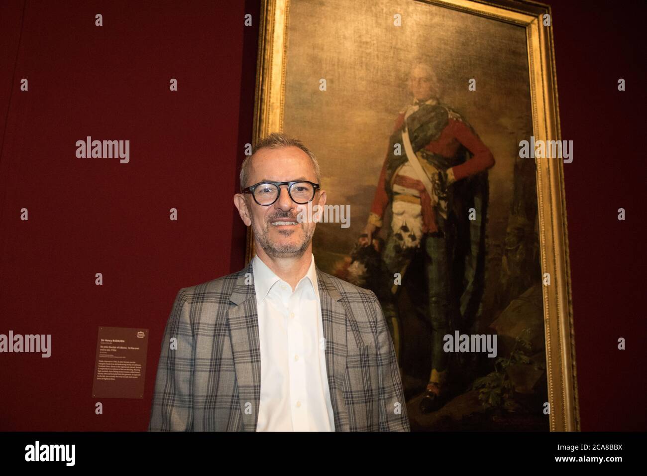 Michael Brand, director of the AGNSW in front of a painting of Sir John Sinclair of Ulbster, 1st Baronet mid to late 1790s, by Sir Henry Raeburn (Scot Stock Photo