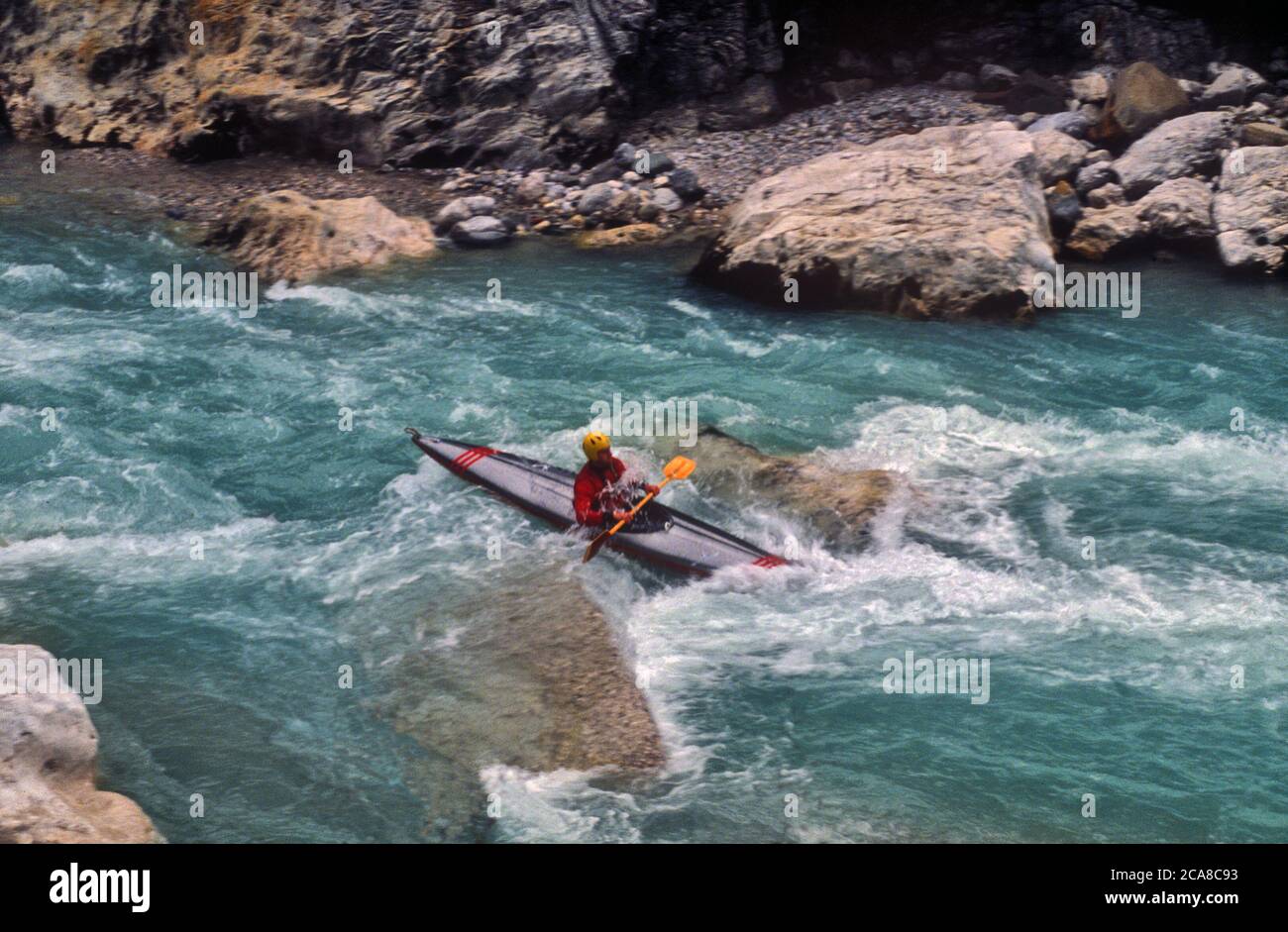 By canoe on the Cellina torrent. Stock Photo