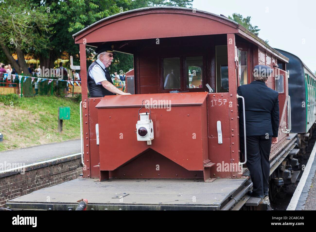 Traditional guardsvan at the rear of a passenger train at Ropley